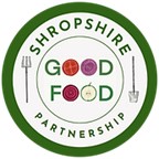 shropshire good food partnership surrounded by the form of a green plate with two forks on the outside