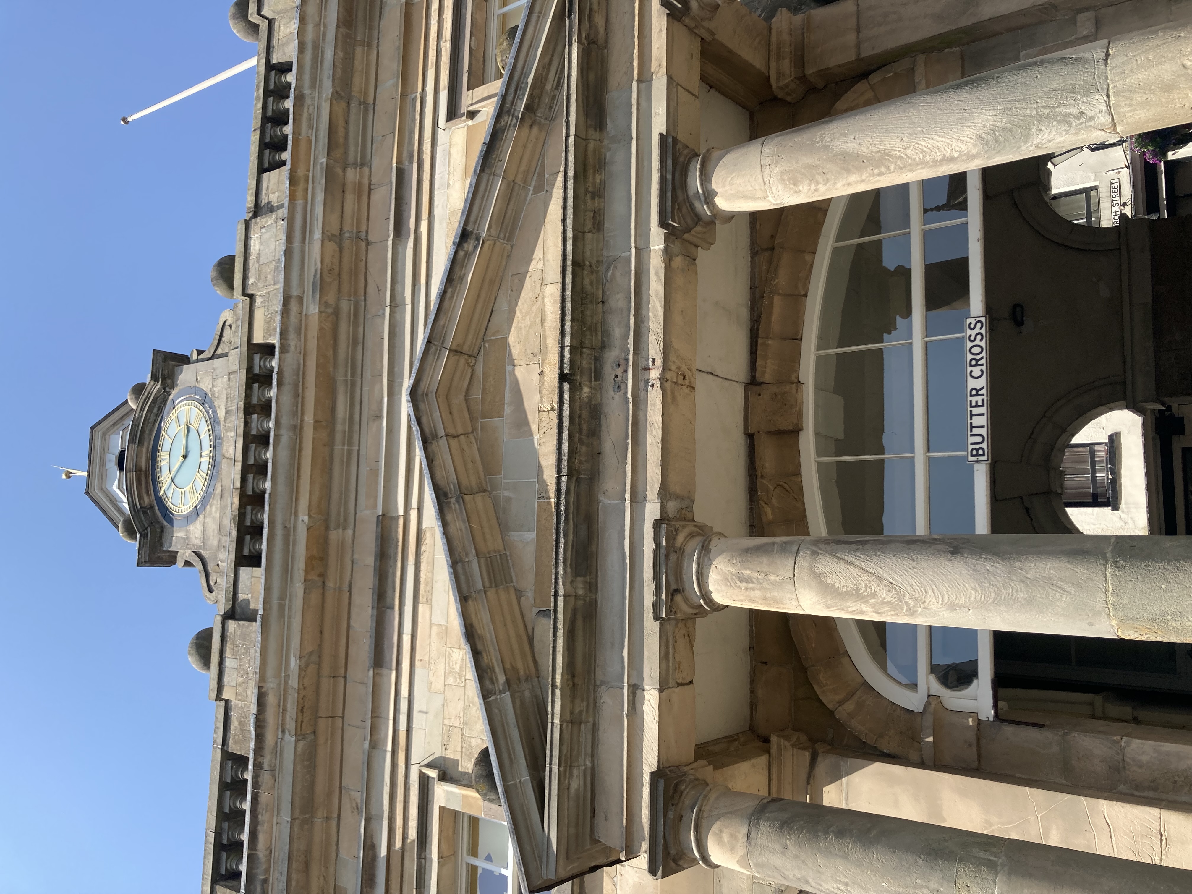 looking up from the pavement below the buttercross to its bell