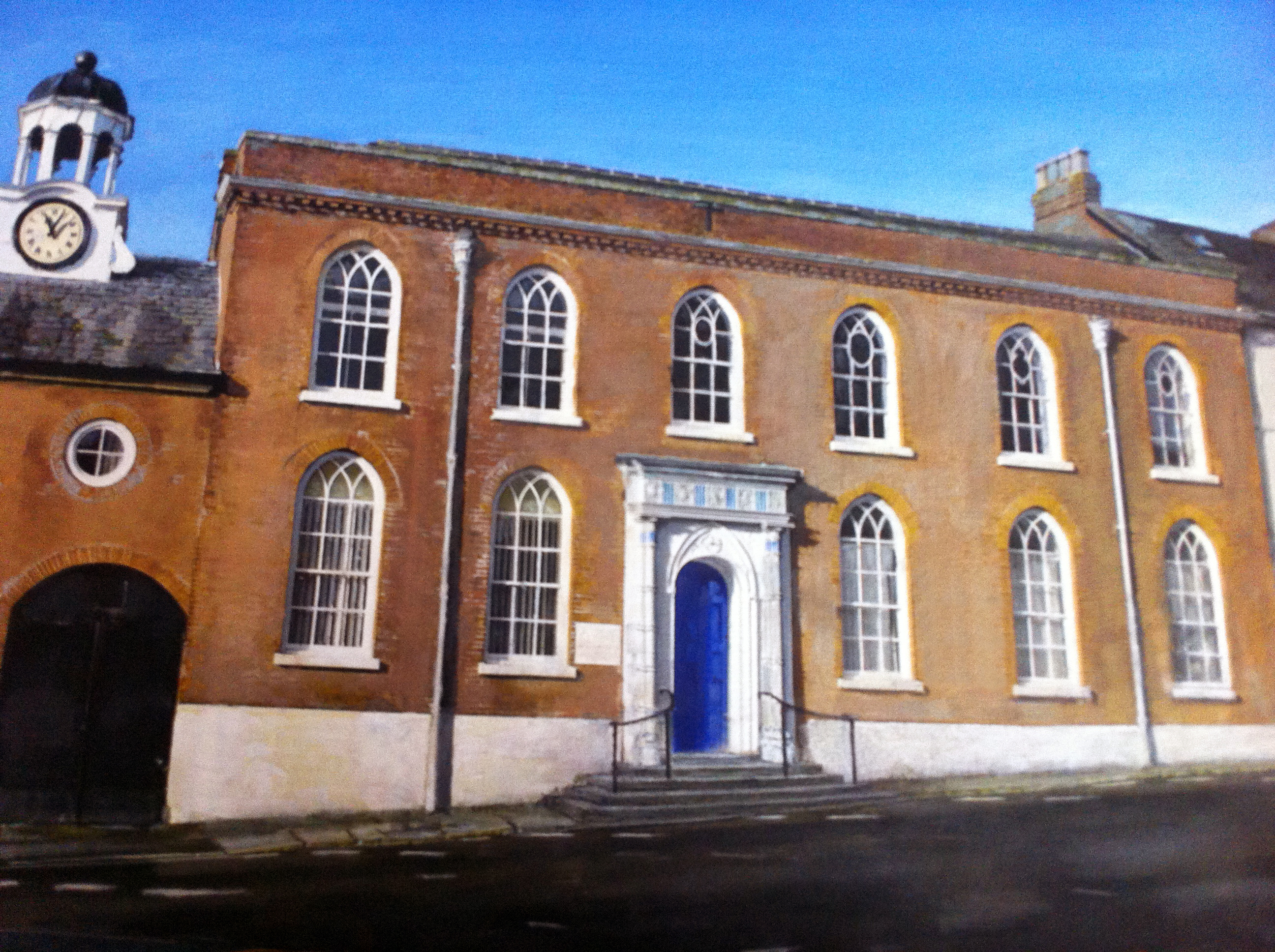 the reedbricked guildhall with large arched windows stands on mill street Ludlow