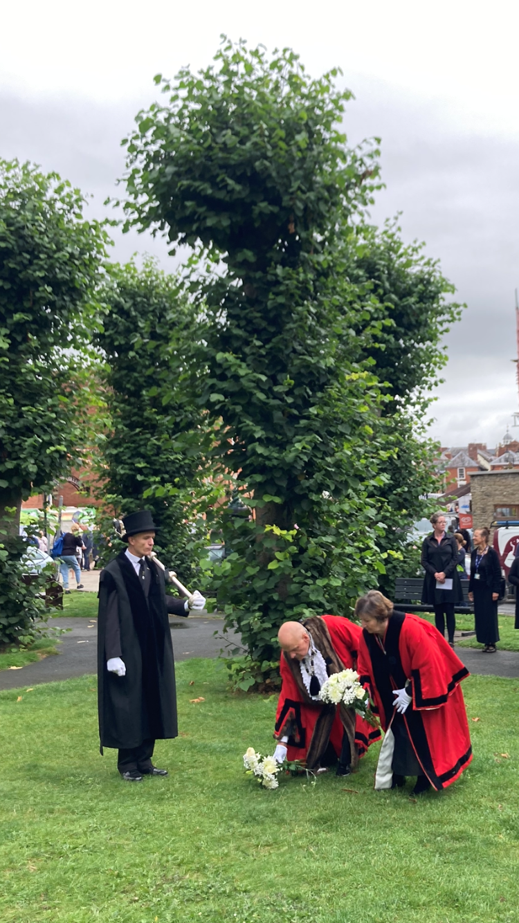 The Mayor and deputy lay the first flowers in the castle garden