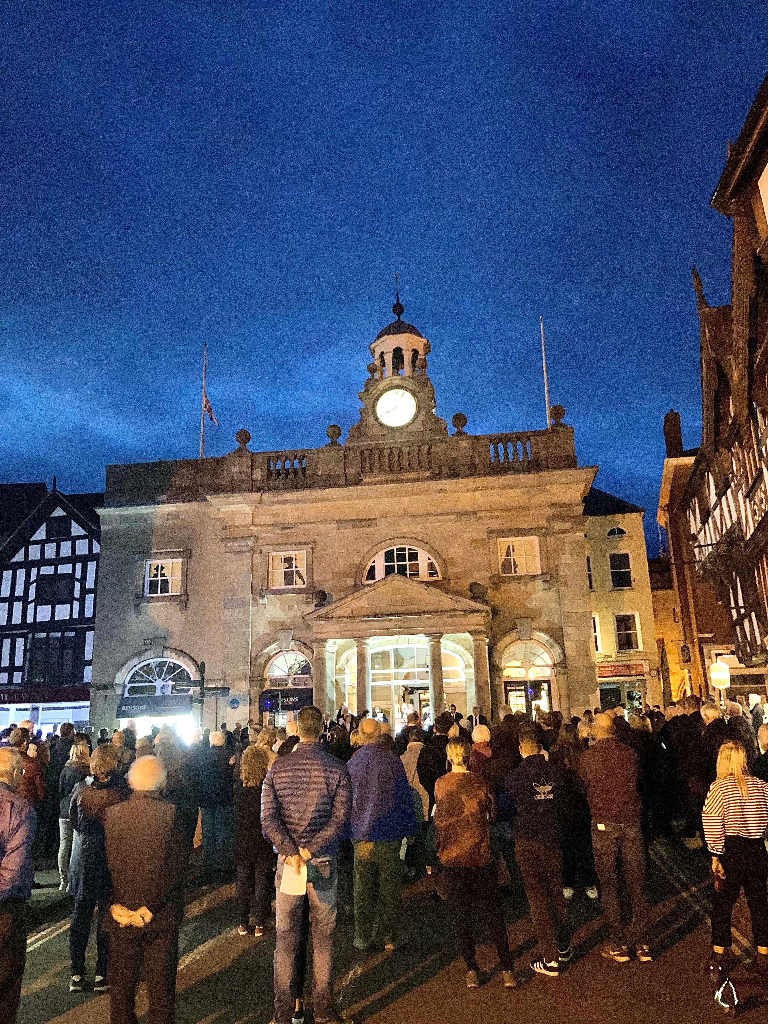 a large crowd gathered infront of the butttercross museum