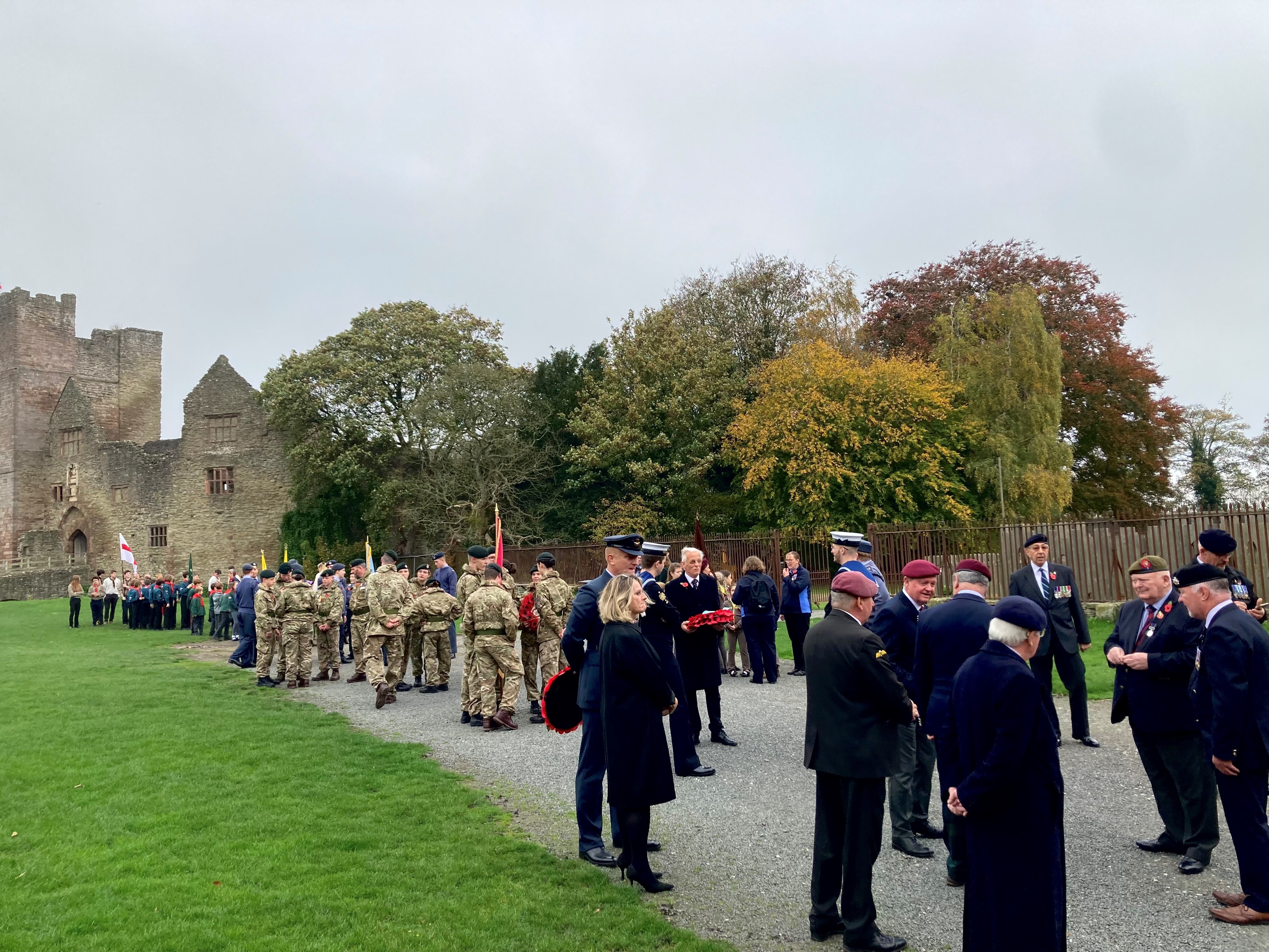 the parade of veterans and civic groups gather in the castle