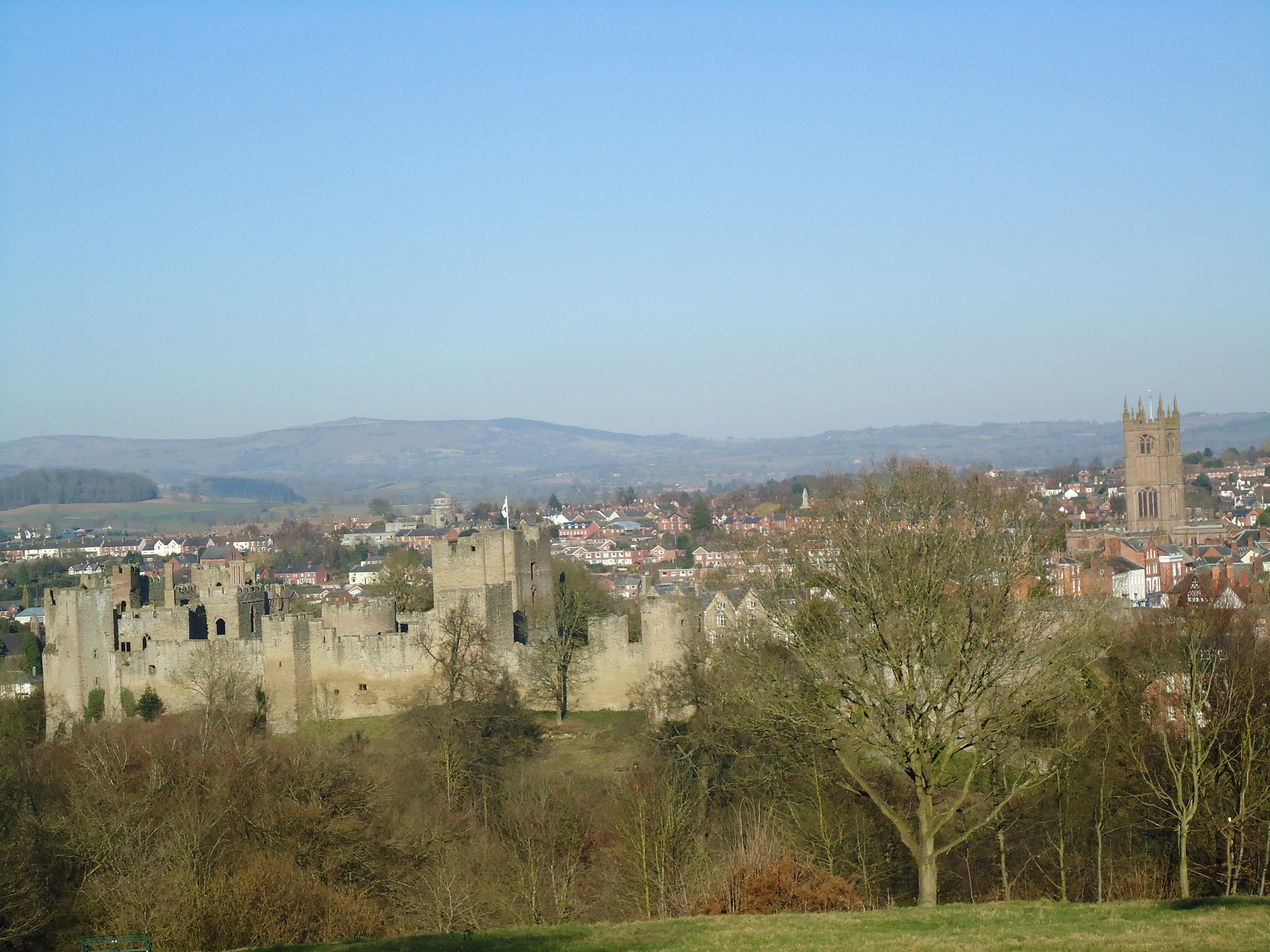 The castle walls from above with the steeple of st Laurences in the background